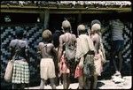 People looking into the meeting house at Ngarianaasuru