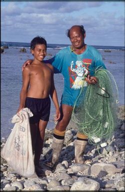 Man and child with fishing nets