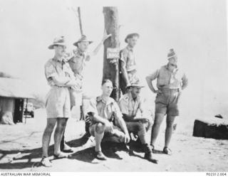 An informal group portrait of officers and senior non-commissioned officers from the Anti Aircraft Battery Rabaul at the battery's position at Frisbee Ridge not long before the Japanese attacks on ..