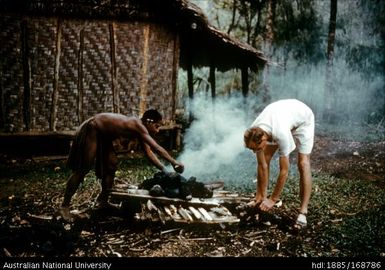 Food preparation, cooking and serving - Making the stones hot for putting in Mumu