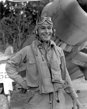 World War II (WWII) era photograph of US Marine Corps (USMC) First Lieutenant (1LT) John F. Bolt, Marine Fighter Squadron 214 (VMF-214)"Black Sheep"taken at Vella La Vella, December 5, 1943 as he stands in front of a USMC F4U"CORSAIR"aircraft. 1LT Bolt is an Ace Pilot credited with 6 kills. His hometown is Sanford, Florida