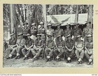 BOUGAINVILLE. 1945-04-28. BRIGADIER J. FIELD, COMMANDER 7 INFANTRY BRIGADE (5), WITH A GROUP OF STAFF OFFICERS. (FOR IDENTIFICATION OF 17 NAMED PERSONNEL TO PROVISIONAL CAPTION OR NAME INDEX)