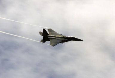 An F-15 Eagle fighter from the 44th Fighter Squadron (FS), Kadena Air Force Base (AFB), Okinawa, Japan, performs aerial maneuver over the skies of Andersen AFB, Guam