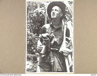 GUY'S POST, FARIA RIVER AREA, NEW GUINEA. 1943-11-08. NX13397 PRIVATE W. C. EATHER OF CAMPBELLTOWN, NSW, AND OF THE 2/33RD AUSTRALIAN INFANTRY BATTALION MOVING TO GUY'S POST TO RELIEVE MEMBERS OF ..