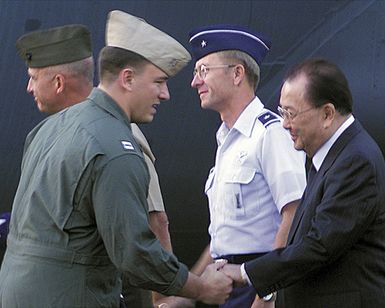 Lieutenant (LT) Shane Osborn, USN, Commander of the USN EP-3 Aries II aircraft involved in the March 31st accident with a Chinese F-8 aircraft, shakes hands with The Honorable US Senator Daniel Inouye (D-Hawaii), upon his arrival at Hickam AFB, Hawaii. The aircrafts crew arrived at Hickam AFB, HI from Anderson AB, Guam on board an USAF C-17 Globemaster III aircraft, as part of Operation VALIANT RETURN. The EP-3 crew members were detained in China for 17 days prior to being released