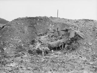 WANDOKAI, NEW GUINEA. 1944-04-18. THE EFFECTS OF 5 ROUNDS OF HE (HIGH EXPLOSIVE) AMMUNITION FIRED BY MEMBERS OF THE 1ST TANK BATTALION FROM THE 3 INCH HOWITZER OF A MATILDA TANK AGAINST A JAPANESE ..