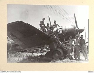 BUT, NEW GUINEA. 1945-04-02. A SINGLE ENGINED "SONIA" JAPANESE RECONNAISSANCE FIGHTER AIRCRAFT, THE ONLY PLANE TO ESCAPE PRACTICALLY UNSCATHED FROM THE BLITZ ON BUT AERODROME. IT IS BEING ..