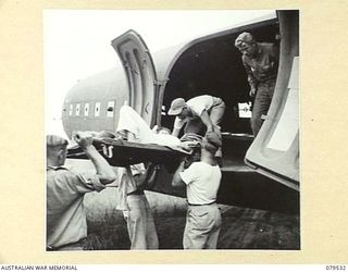 DREGER HARBOUR, NEW GUINEA. 1944-01. PERSONNEL OF THE 10TH FIELD AMBULANCE LOADING STRETCHER CASES ABOARD A UNITED STATES AIRCRAFT FOR TRANSPORT BACK TO THE MAINLAND