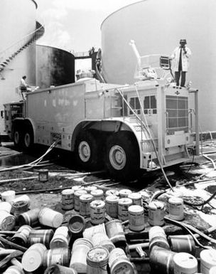 A view of a P-15 fire engine at a fuel storage fire scene. Hickam Air Force Base Honolulu firemen just completed fighting the fire