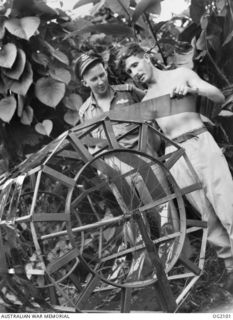 TOROKINA, BOUGAINVILLE ISLAND, SOLOMON ISLANDS. C. 1945-01-16. PHOTOGRAPHY PLAYS AN IMPORTANT PART IN THE WORK OF NO. 5 (ARMY CO-OPERATION) SQUADRON RAAF. 402541 FLYING OFFICER E. G. REYNOLDS, WEST ..