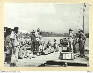 NORTH ALEXISHAFEN, NEW GUINEA. 1944-08-18. THE MEDICAL LAUNCH, AM1567, OF THE NEW GUINEA SEA AMBULANCE TRANSPORT COMPANY, LOADING A STRETCHER CASE FROM THE 111TH CASUALTY CLEARING STATION, NAGADA, ..