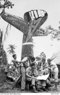 SENTANI, DUTCH NEW GUINEA, 1944-07-31. 80 SQUADRON "COOPERS FLYING CIRCUS". PILOT OFFICER DON HILLIER (FRONT LEFT) AND SQUADRON LEADER GLEN COOPER (MIDDLE)