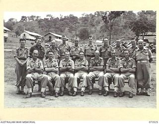 PORT MORESBY, NEW GUINEA. 1944-05-31. A GROUP OF SENIOR NCOS OUTSIDE THEIR MESS AT THE NEW GUINEA DETAILS DEPOT. THEY ARE RESPONSIBLE FOR THE EFFICIENT FUNCTIONING OF THE DEPOT. THE MAJORITY ARE ..