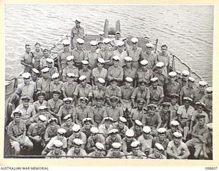 RABAUL, NEW BRITAIN. 1945-10-30. OFFICERS AND CREW ON THE QUARTERDECK OF HMAS KIAMA