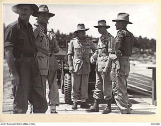 TOL PLANTATION, WIDE BAY, NEW BRITAIN. 1945-07-02. HIS ROYAL HIGHNESS, THE DUKE OF GLOUCESTER, GOVERNOR-GENERAL OF AUSTRALIA (4), SPEAKING WITH BRIGADIER R.E. WINNING, COMMANDER 13 INFANTRY BRIGADE ..