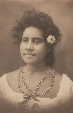 Woman with a rose behind her ear