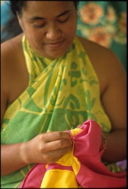 Woman sewing tivaevae