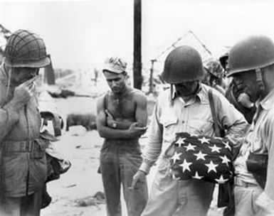 [Marines Examining American Flag Pillow]