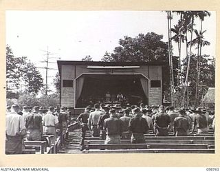 LAE, NEW GUINEA. 1945-11-11. TROOPS OF FIRST ARMY ATTENDING THE ARMISTICE DAY SERVICE ON THE BUTIBUM SITE