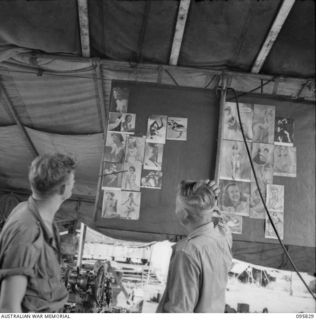 CAPE WOM, WEWAK AREA, NEW GUINEA. 1945-08-29. CRAFTSMAN R. MARTIN-YATES (1) AND STAFF SERGEANT J.N. DARK (2), AT 110 BRIGADE WORKSHOP, CORPS OF AUSTRALIAN ELECTRICAL AND MECHANICAL ENGINEERS, ..