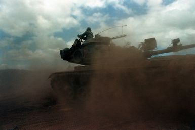 An M60 main battle tank with its turret traversed to the rear is used by Company C, 3/4 Cavalry, 25th Infantry Division, during a live fire exercise at the Pohakuloa Training Area