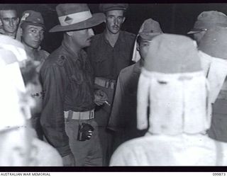 RABAUL, NEW BRITAIN, 1946-03-01. AFTER A LONG PERIOD OF HEAT, SELF COMBUSTION OF CORDITE CAUSED A FIRE IN 5,500 TONS OF JAPANESE AMMUNITION AWAITING DUMPING OFF RABAUL. ALL THE AMMUNITION WAS ..