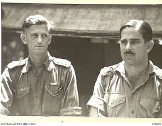 MALMAL, NEW BRITAIN. 1945-01-29. VX15619 CAPTAIN R.O. BEAL, GENERAL STAFF OFFICER III (INT) (1) AND SX2855 MAJOR E.H. BURGESS GSO II (2) HEADQUARTERS 5TH DIVISION