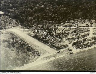 BOUGAINVILLE ISLAND, SOLOMON ISLANDS. C. 1945-02. AERIAL PHOTOGRAPH OF VERNON AIRSTRIP WHICH WAS ESTABLISHED NEAR MAWARAKA FOR USE BY AUSTER AIRCRAFT OF NO. 17 AIR OBSERVATION POST RAAF IN SUPPORT ..