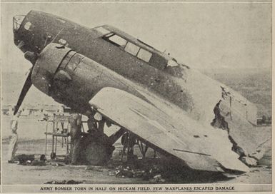 The bombing raid on Pearl Harbour: army bomber torn in half on Hickam field. Few warplanes escaped damage