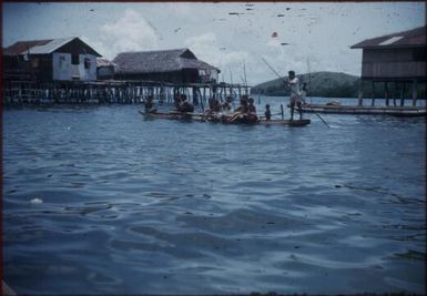 Tupesleia village, children on a boat : Port Moresby, Papua New Guinea, 1953 / Terence and Margaret Spencer