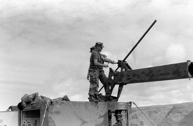 Members of Marine Air Control Squadron 2 (MACS-2) erect an AN/TPS-63 tactical surveillance radar unit during Operation KERNAL BLITZ