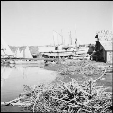 Fishing boats drawn up on beach, Rabaul Harbour, New Guinea, 1937 / Sarah Chinnery