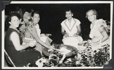 Eileen Powles eating with three other women, Samoa