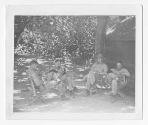 [Servicemen Sitting in Chairs on Guadalcanal]