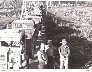 MADANG, NEW GUINEA. 1944-08-15. A SECTION OF A CONVOY OF SOME 57 TRUCKS FROM THE 165TH GENERAL TRANSPORT COMPANY AT GUM VILLAGE WHERE THEY ARE TO PICK UP SOME 2000 NATIVE LABOURERS AND TRANSPORT ..