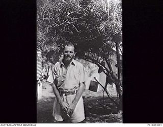 PORT MORESBY, C. 1943-03. SICK BAY ATTENDANT BARREL, A MEMBER OF THE RAN. (PHOTOGRAPHER: SURGEON LIEUTENANT COMMANDER G. A. ROBSON, OF GAWLER, SA). (ORIGINAL PRINT HELD IN AWM ARCHIVE STORE) ..