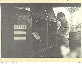 LAE, NEW GUINEA, 1944-03-29. NX147244 SAPPER L. MONCRIEFF, OPERATING THE SPERRY GENERATION PLANT AT N HEAVY BATTERY, ROYAL AUSTRALIAN ARTILLERY ATTACHED TO HEADQUARTERS LAE BASE SUB-AREA. THESE ..