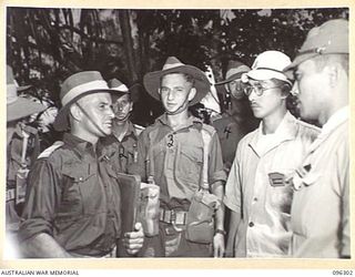 KAHILI, SOUTH BOUGAINVILLE. 1945-09-09. MAJOR F.C. TAYLOR, BUIN LIAISON GROUP, 2 CORPS (1) AND MEMBERS OF HIS PARTY, WITH JAPANESE REPRESENTATIVES