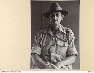 LAE, NEW GUINEA. 1945-10-04. LIEUTENANT COLONEL G.S. BAKER, DEPUTY DIRECTOR OF ORDNANCE SERVICE ATTACHED HEADQUARTERS FIRST ARMY