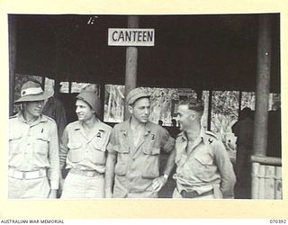 MILNE BAY, NEW GUINEA, 1944-02-12. ALLIED TROOPS OUTSIDE THE CANTEEN AT THE TROOPS' CLUB ESTABLISHED BY THE AUSTRALIAN ARMY CANTEENS SERVICE. IDENTIFIED PERSONNEL ARE: NX155754 SAPPER W. LEES, 4TH ..