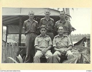 MILILAT, NEW GUINEA. 1944-07-22. OFFICERS OF THE 5TH SURVEY BATTERY. IDENTIFIED PERSONNEL ARE:- NX103513 LIEUTENANT F.M. READ (1); NX102720 LIEUTENANT J.A. NEWBIGGING (2); NX102707 LIEUTENANT H.M. ..