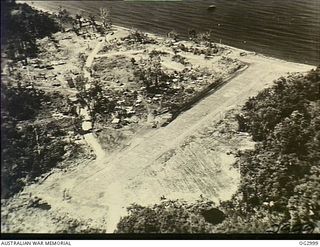 BOUGAINVILLE ISLAND, SOLOMON ISLANDS. C. 1945-02. AERIAL PHOTOGRAPH OF VERNON AIRSTRIP WHICH WAS ESTABLISHED NEAR MAWARAKA FOR USE BY AUSTER AIRCRAFT OF NO. 17 AIR OBSERVATION POST RAAF IN SUPPORT ..