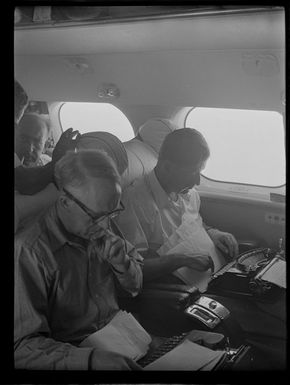 Journalists, Mr R Mason and Mr Colin [Fraden?], onboard aircraft TEAL (Tasman Empire Airways Limited), Tahiti trip