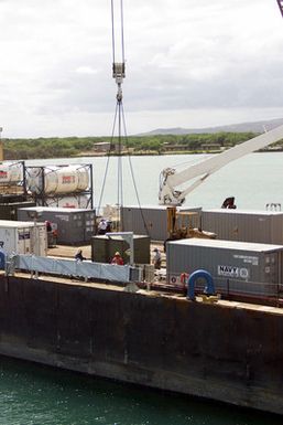 A view showing equipment being loaded onto the Crowley 450-10 barge at pier A5, Pearl Harbor, Hawaii (HI), during recovery operations for the Japanese fishing vessel Ehime Maru