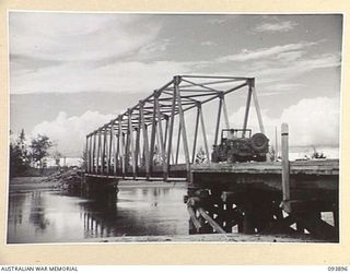 TAGESSI, BOUGAINVILLE, 1945-07-11. THE STEELE BRIDGE (NAMED AFTER ITS DESIGNER COLONEL C.S. STEELE) ERECTED OVER THE TAGESSI RIVER BY 11 FIELD COMPANY, ROYAL AUSTRALIAN ENGINEERS, TO REPLACE THE ..