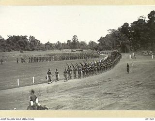 LAE, NEW GUINEA. 1944-03-08. TROOPS OF THE 47TH INFANTRY BATTALION MARCH TO THE PARADE GROUND AFTER PASSING THE SALUTING BASE, DURING INSPECTION OF THE 29TH INFANTRY BRIGADE BY VX20308 ..