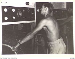 SIMPSON HARBOUR, NEW BRITAIN. 1945-10-13. THE ENGINE ROOM OF THE MOTOR LAUNCH 825, ROYAL AUSTRALIAN NAVY. THE VESSEL IS THE ONLY MOTOR LAUNCH IN THE SOUTH WEST PACIFIC AREA TO BRING DOWN A JAPANESE ..