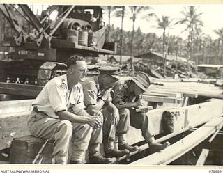 JACQUINOT BAY, NEW BRITAIN. 1945-01-24. B5/29 REPRESENTATIVE K. WATTS, YOUNG MEN'S CHRISTIAN ASSOCIATION (1), NX151690 LIEUTENANT J.D. STEVENSON, OFFICER- IN- CHARGE, WORKS, 17TH FIELD COMPANY (2) ..