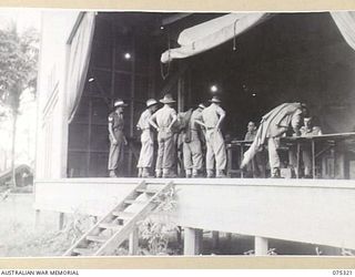 LAE, NEW GUINEA. 1944-08-16. TROOPS OF HEADQUARTERS, NEW GUINEA FORCE REGISTERING THEIR VOTE FOR THE AUSTRALIAN FEDERAL REFERENDUM AT THE UNIT PICTURE THEATRE