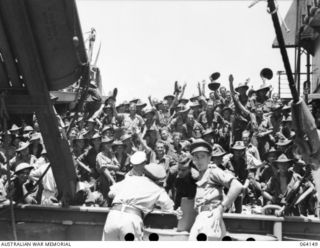 TOWNSVILLE, QLD. 1944-01-28. PERSONNEL OF HEADQUARTERS COMPANY, 2/28TH INFANTRY BATTALION, ABOARD THE SHIP "VAN HEUTSZ" IMPATIENTLY WAITING TO LAND IN AUSTRALIA AFTER THEIR RETURN HOME FROM A LONG ..